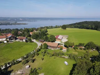 An aerial view of the Ammersee, fields and farms.