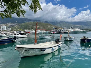 Boats in the port of Budva in Montenegro. Campsites in Montenegro can be found in this article.