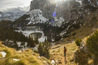 A person wanders through the Durmitor National Park at the campsite in Montenegro.