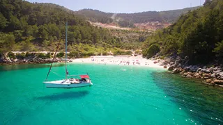 Thasos - beach, sea and sailboat